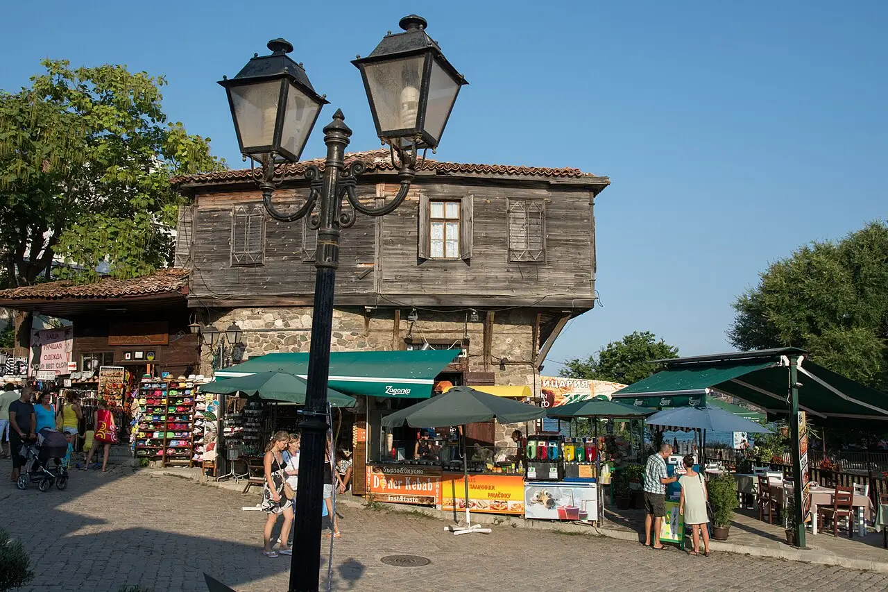 A pedestrian shopping street called Apolonia in Sozopol old town, lined with stalls and street lamps