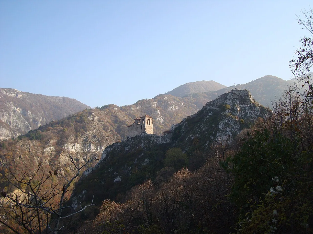 The medieval church of Asen's Fortress perched on a rocky crag among the Rhodope mountains near Bachkovo