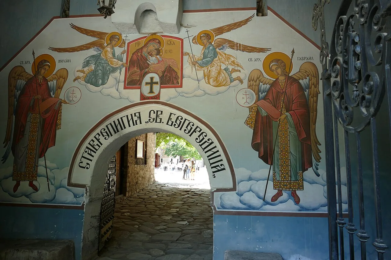 The painted stone gateway of Bachkovo Monastery, with archangels flanking an icon of the Virgin over the arch