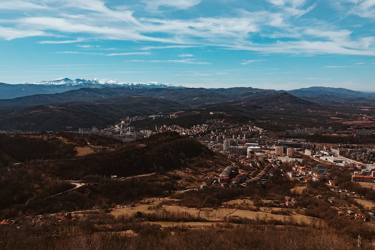 Panorama of Gabrovo rooftops and surrounding hills seen from a higher street