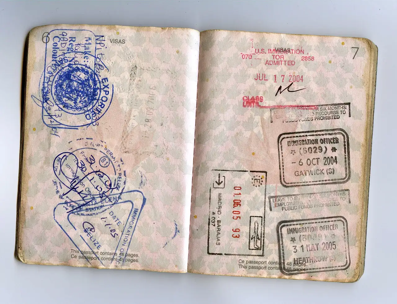 An open passport showing pages of entry and exit stamps