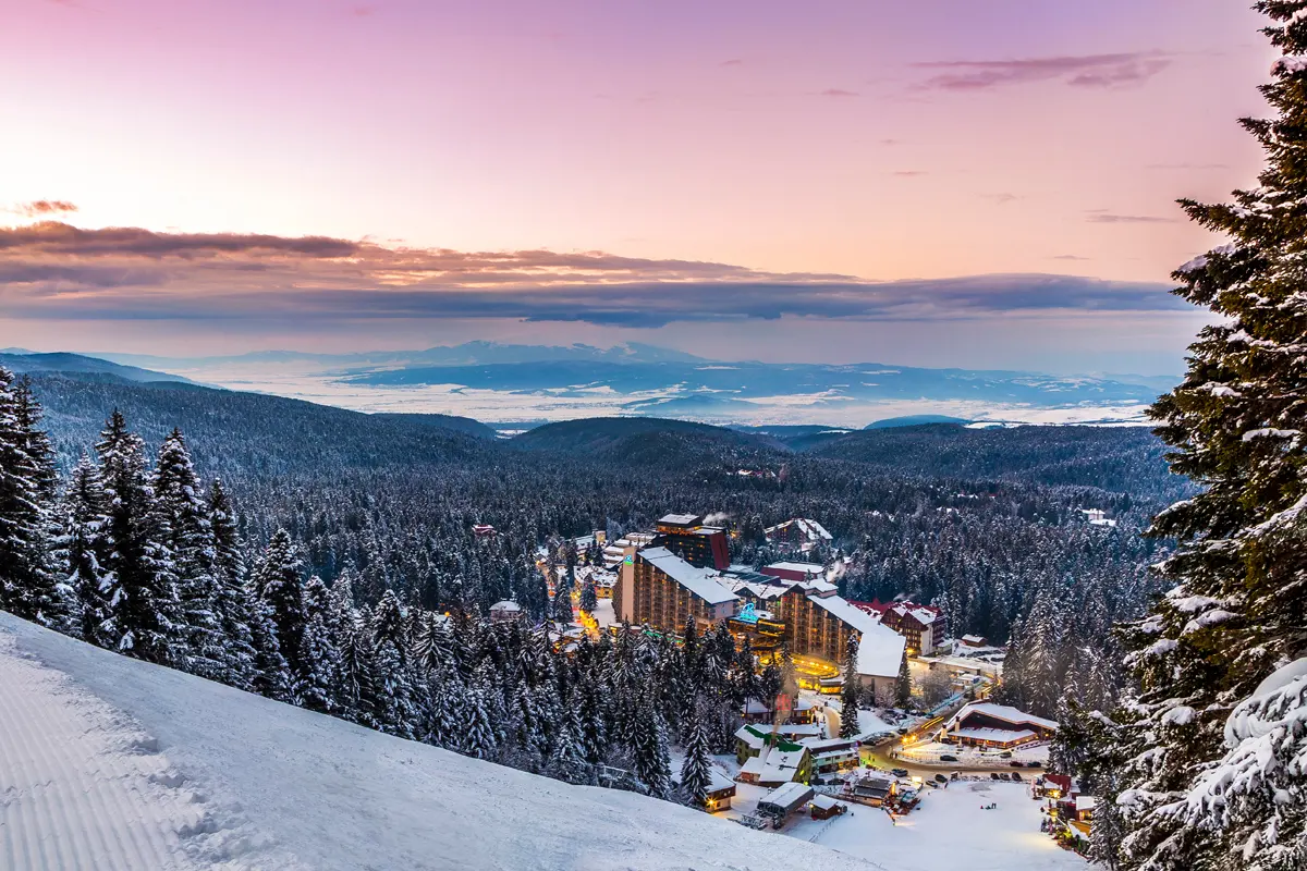 The large Rila Hotel at the base of Borovets, a broad multi-storey ski hotel with the pistes and lifts right beside it