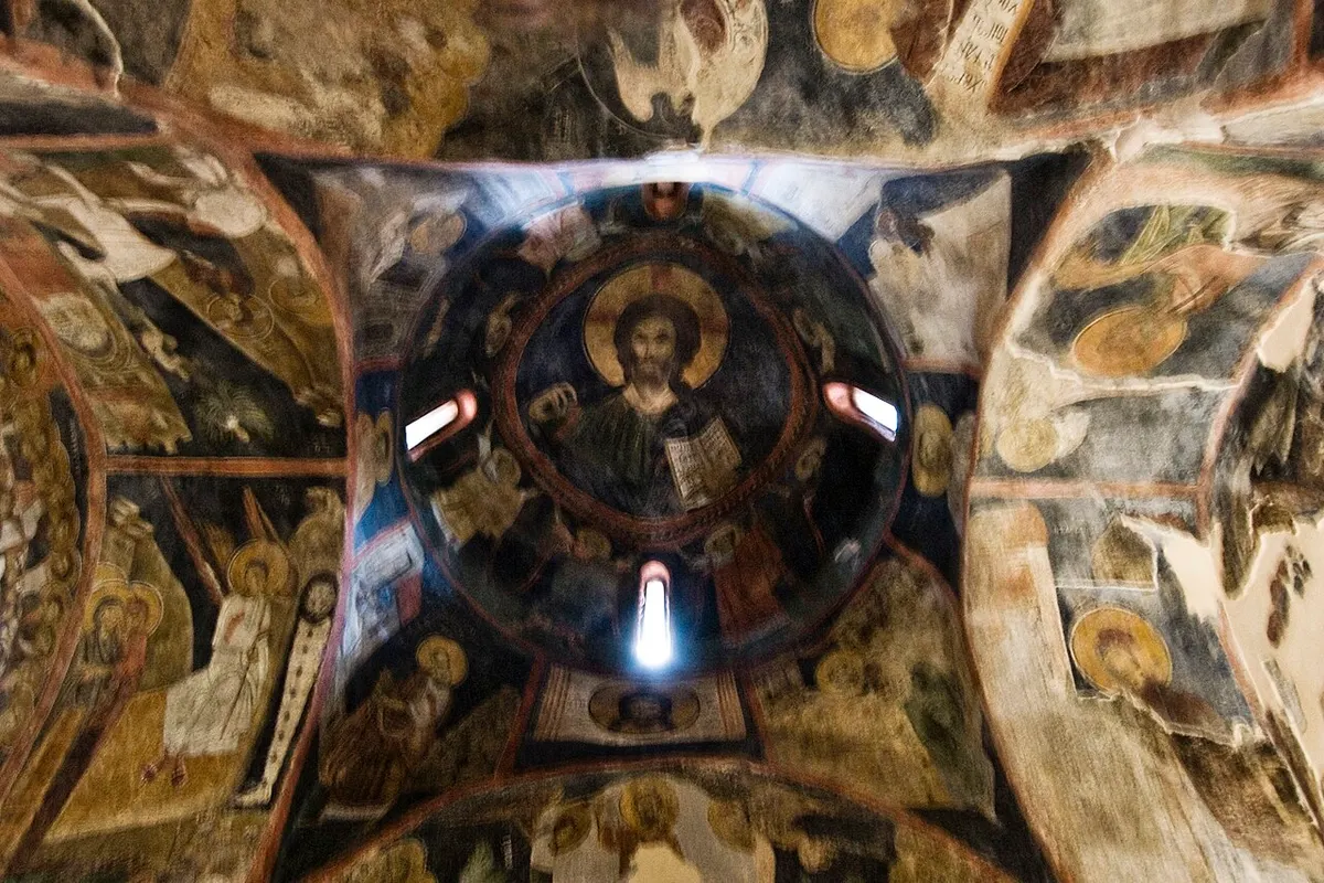 The domed ceiling of Boyana Church with a Christ Pantocrator surrounded by concentric rings of saints