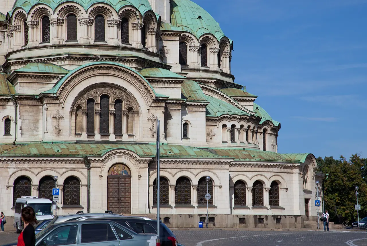 The Alexander Nevsky Cathedral in Sofia seen across its square, gold and green domes above the city