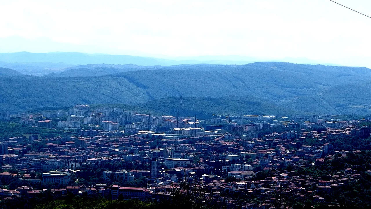 Houses of Veliko Tarnovo stacked up the steep sides of the Yantra river gorge