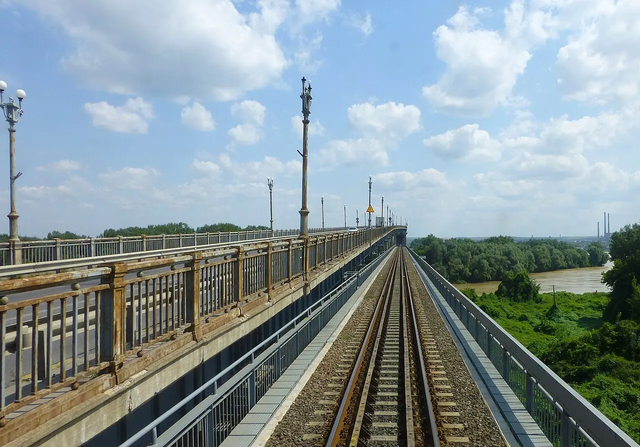 The steel Friendship Bridge over the Danube between Ruse in Bulgaria and Giurgiu in Romania, seen from the riverbank on a clear day