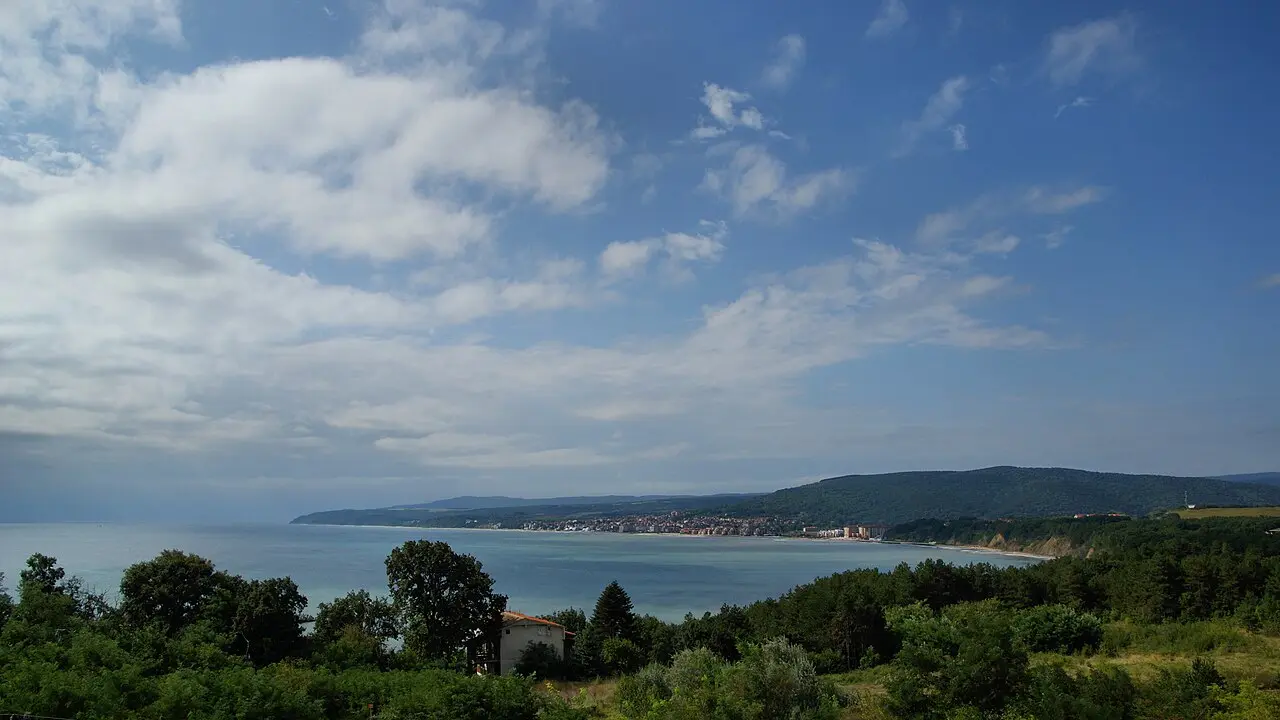 The bay at Obzor seen from a forested hillside, a low-rise town on a long sandy beach midway between Varna and Burgas