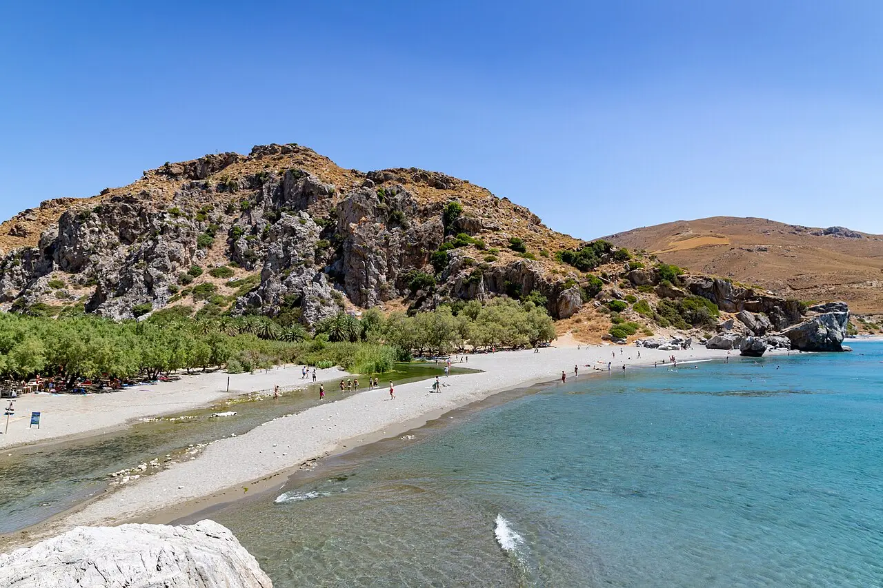 Aerial view of Preveli palm beach on Crete where a river meets the turquoise Libyan Sea