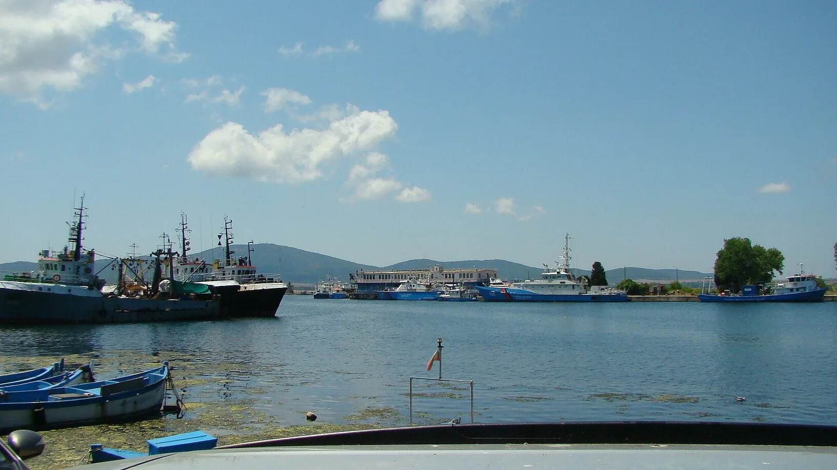Fishing boats and yachts in Sozopol harbour with the old-town peninsula behind