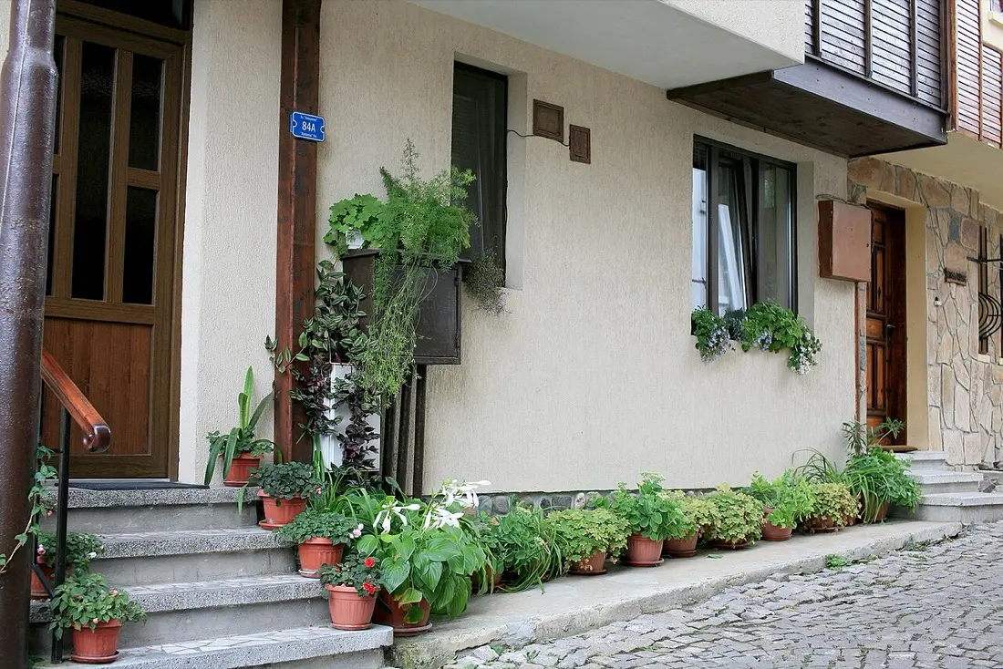 Narrow stone lane and timber Revival houses in Sozopol old town
