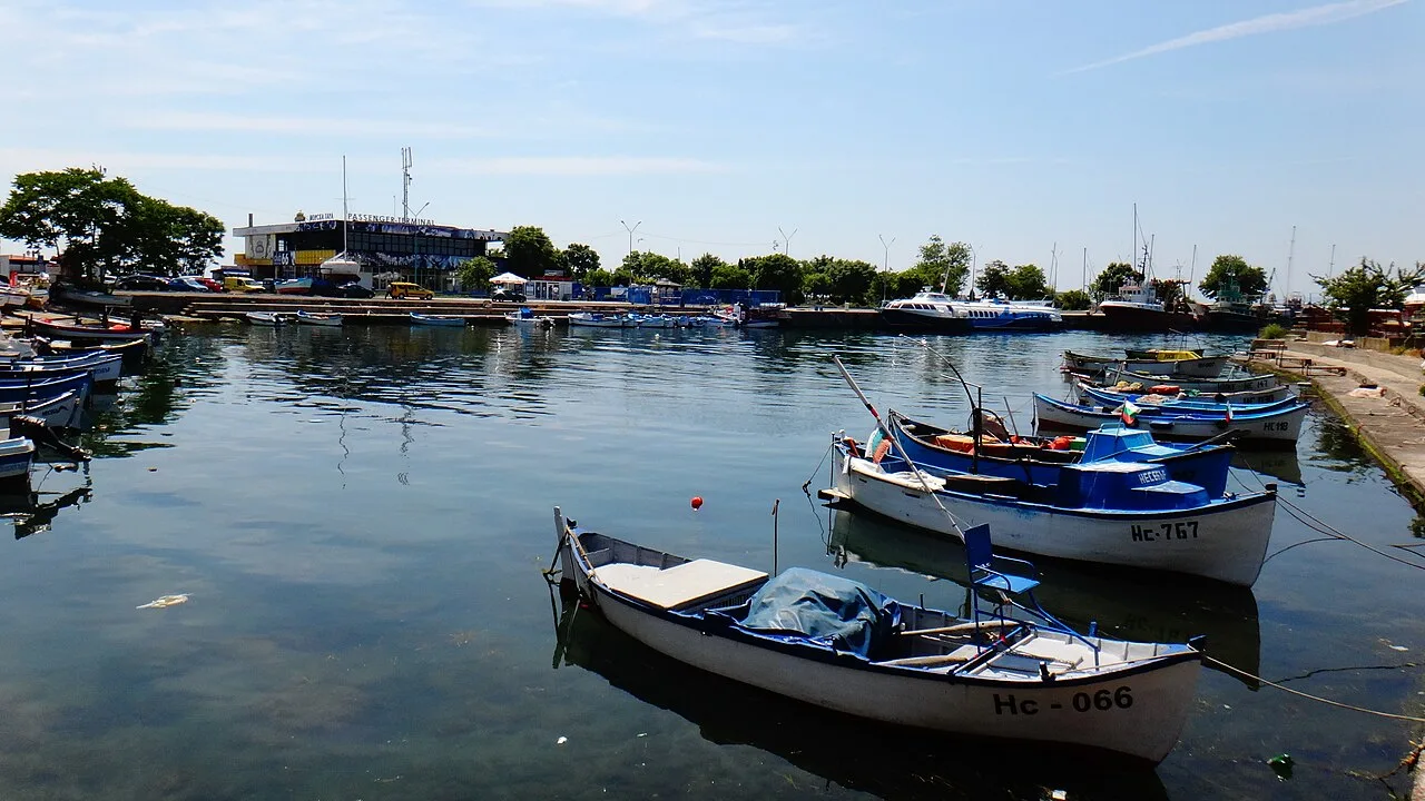 Red-tiled roofs and church towers of Nessebar old town on the Black Sea peninsula under summer haze