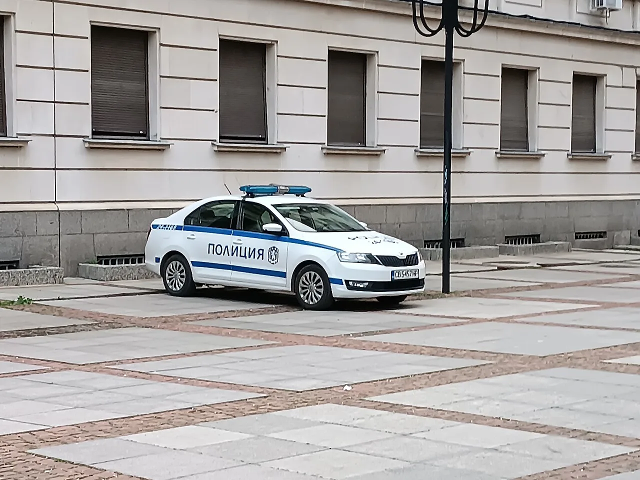 A Bulgarian police Skoda patrol car parked on a street in central Sofia