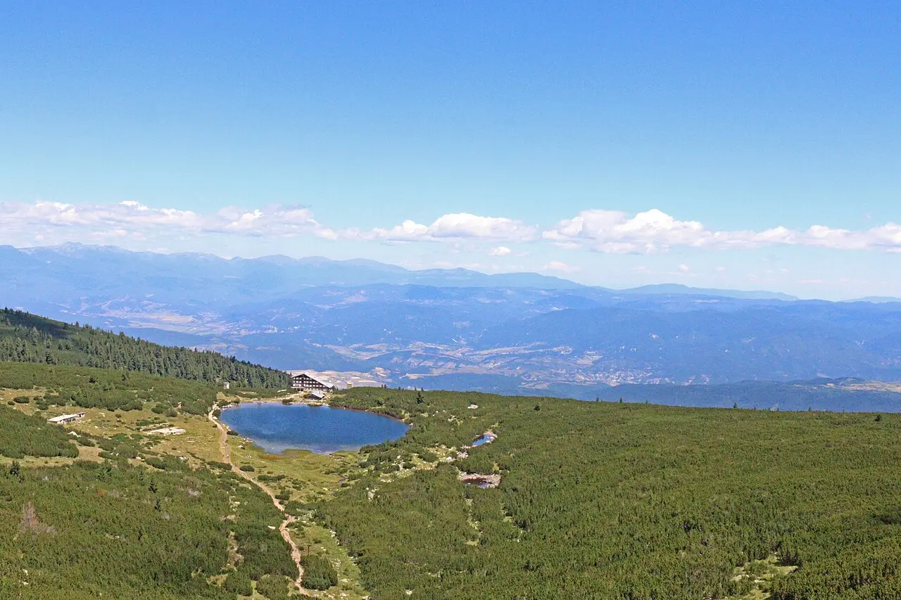 Turquoise Bezbozhko glacial lake under Pirin peaks on a clear day