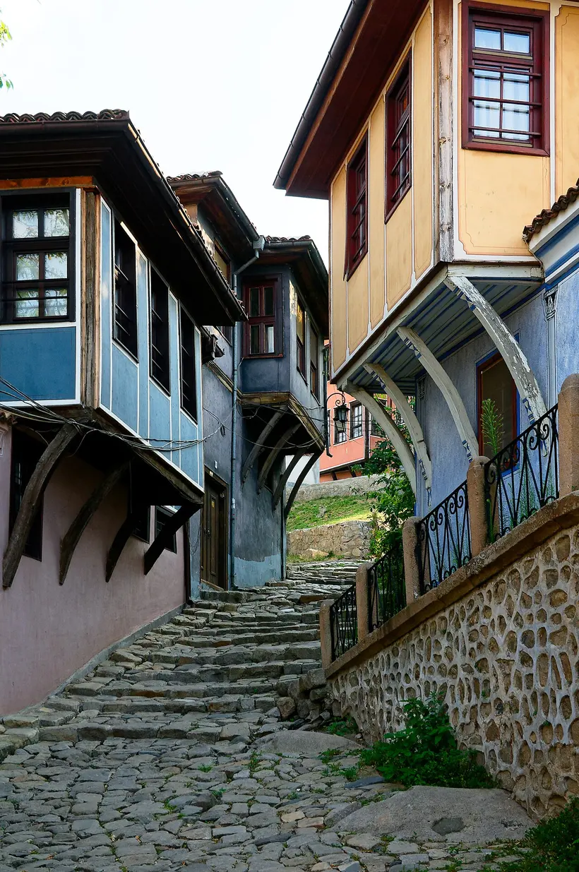A tall timber-framed National Revival mansion in Plovdiv Old Town with a jettied upper floor