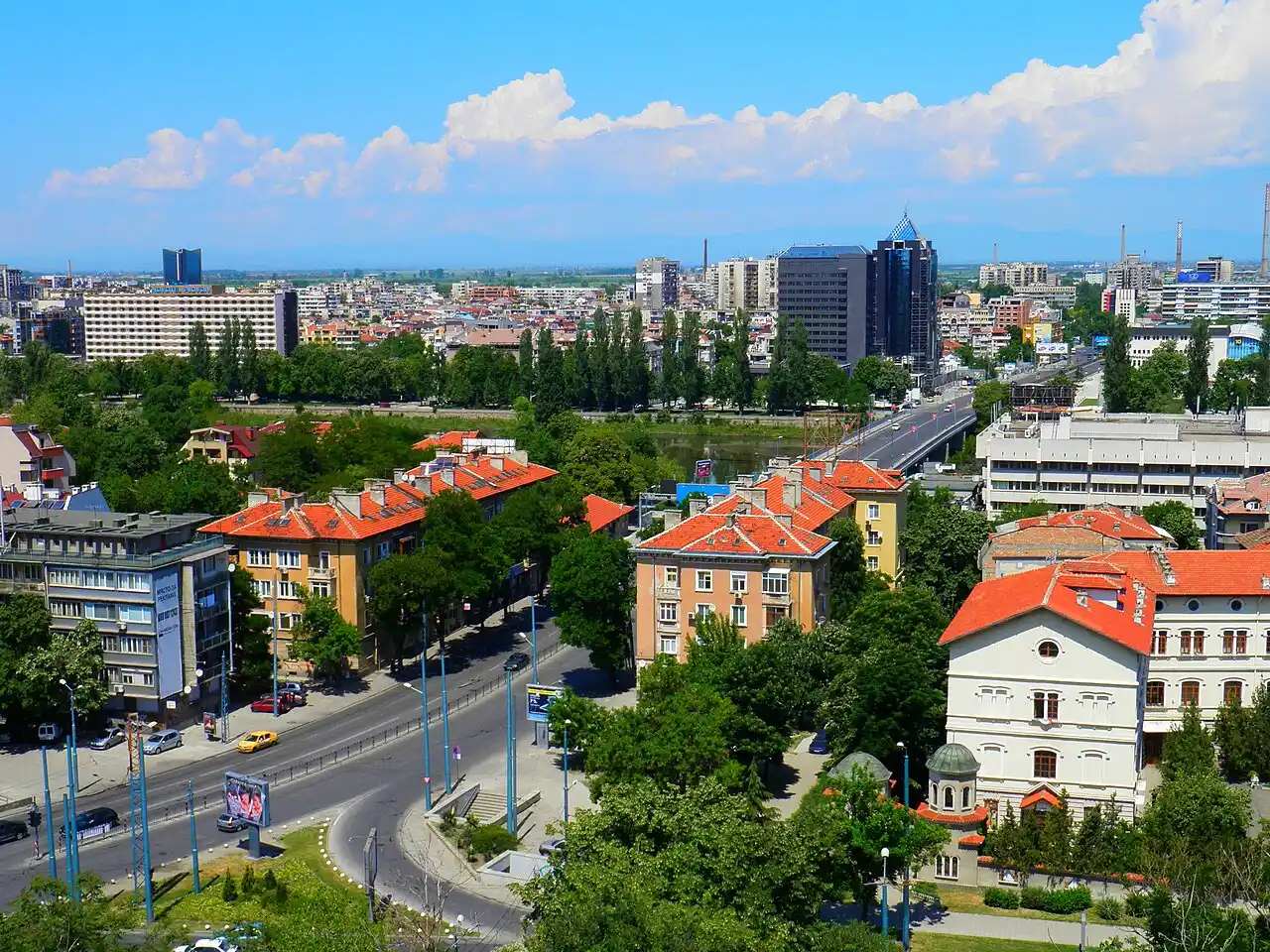 Panorama of Plovdiv with red-tiled roofs, the river and the Rhodope foothills beyond
