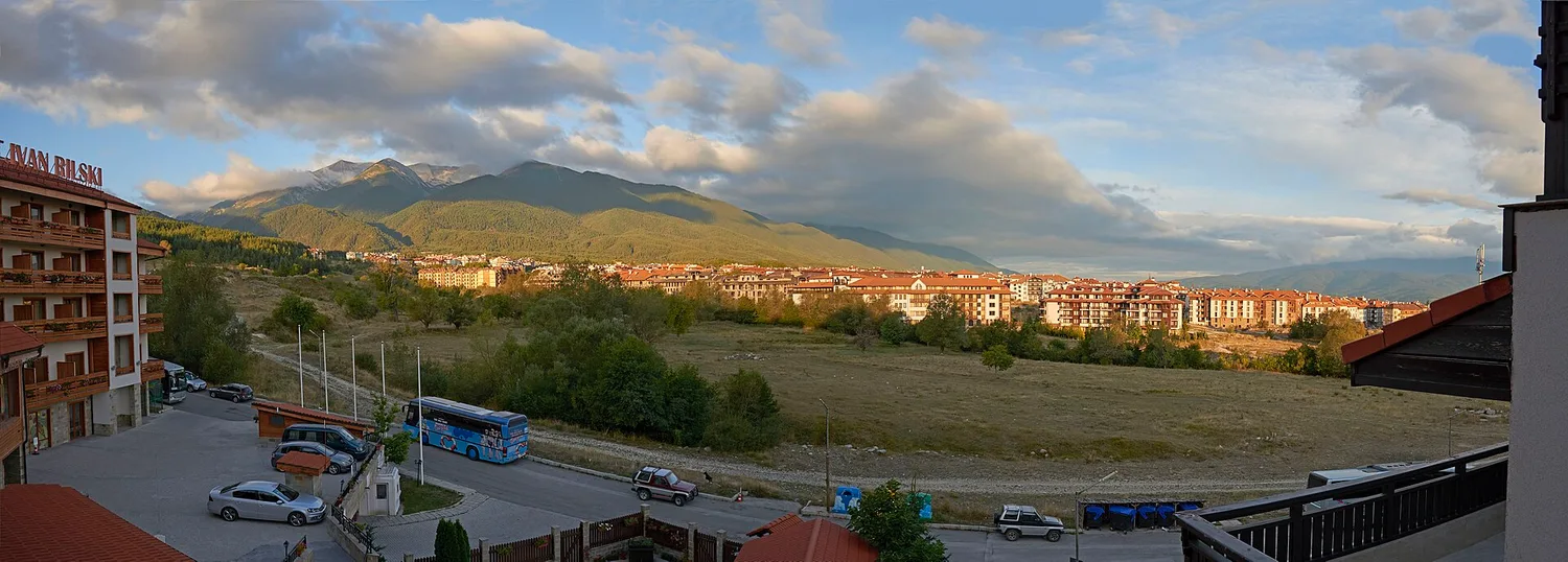 The town of Bansko in evening light with the Pirin mountains rising behind it