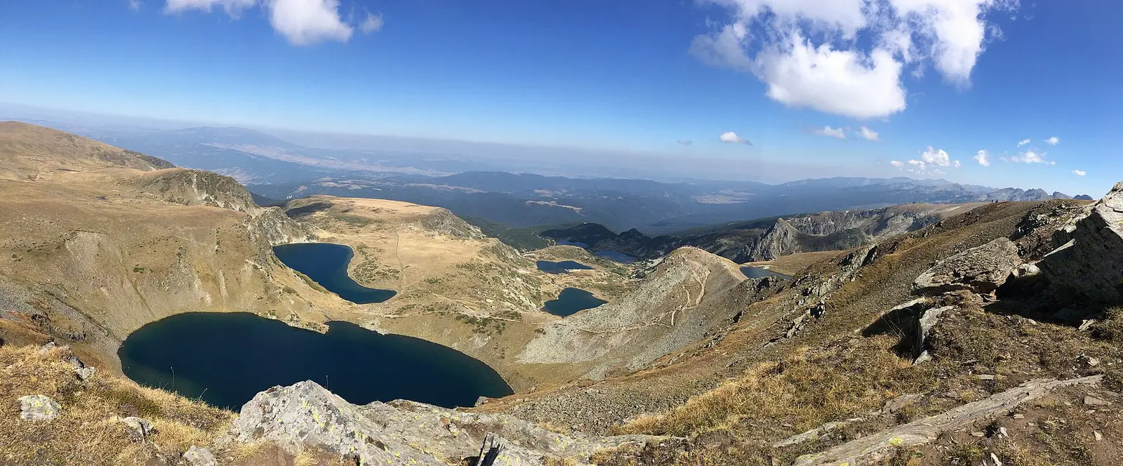 The Seven Rila Lakes seen from above, a chain of blue glacial lakes in the bare Rila mountains