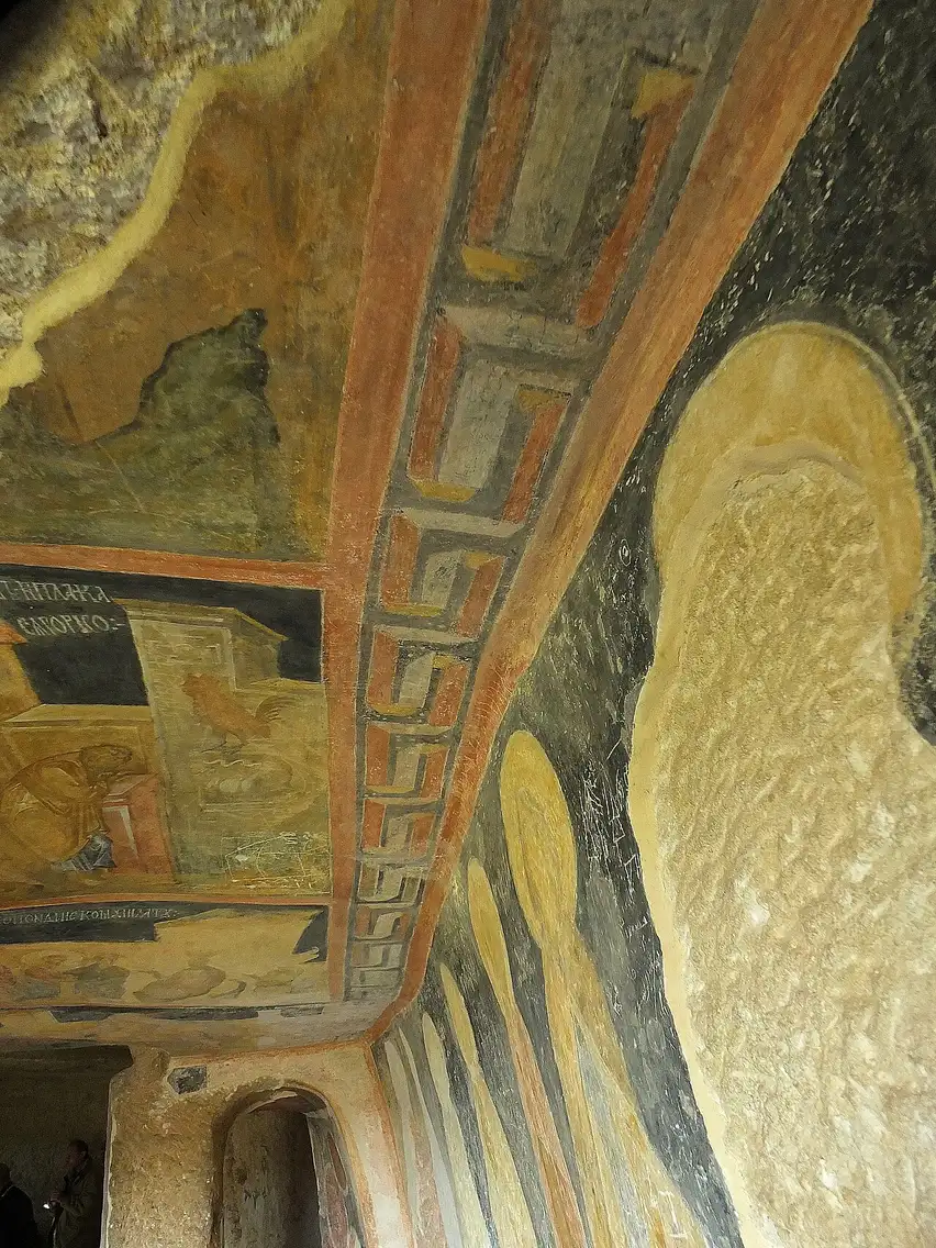 Medieval frescoes on the rock ceiling of a church in the Ivanovo complex, painted in ochre, red and black