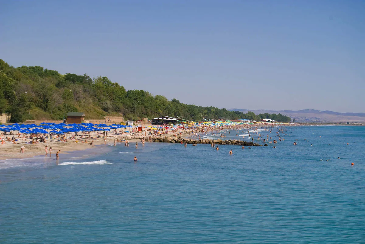 The wide sandy city beach at Burgas with the sea and the Sea Garden park behind