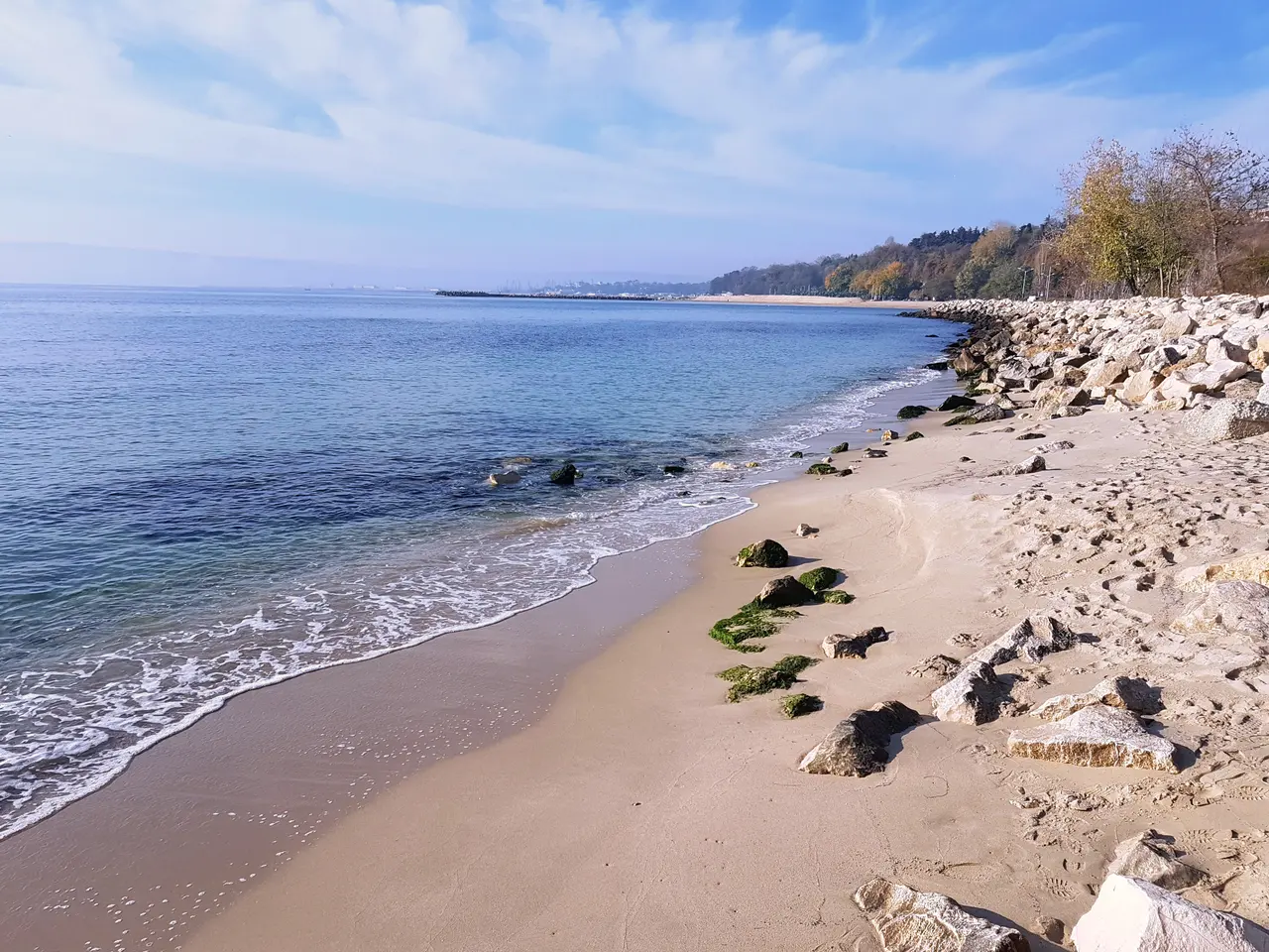 The waterfront Sea Garden park in Varna with paths, greenery and the Black Sea beyond on a summer day