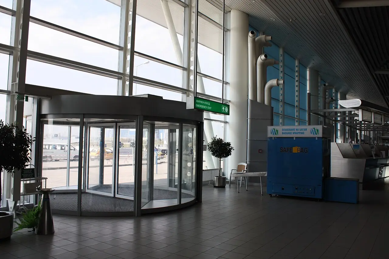 Interior of Sofia Airport with passengers and check-in desks