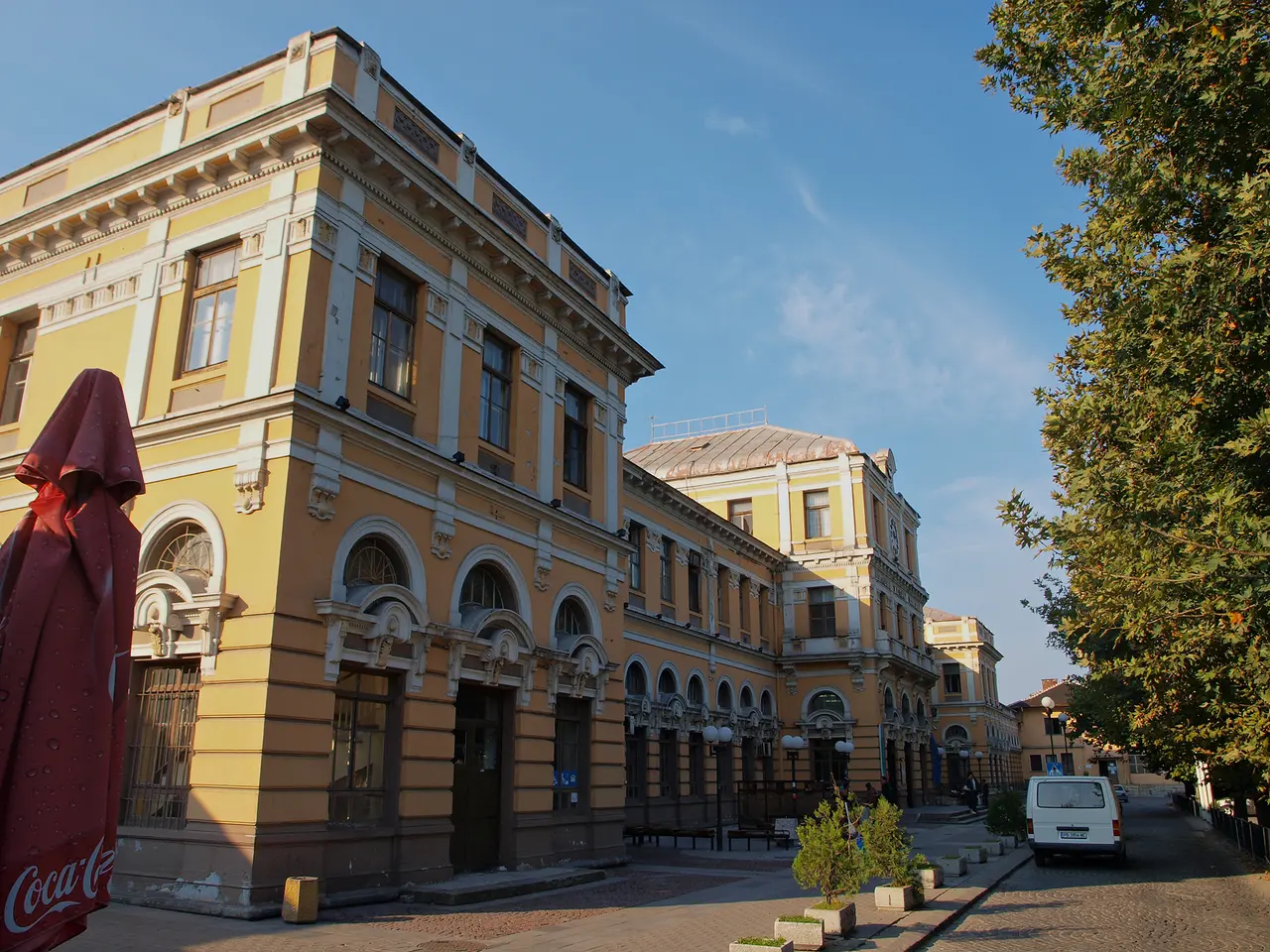 The grand old facade of Plovdiv Central railway station building with its clock and stone detailing