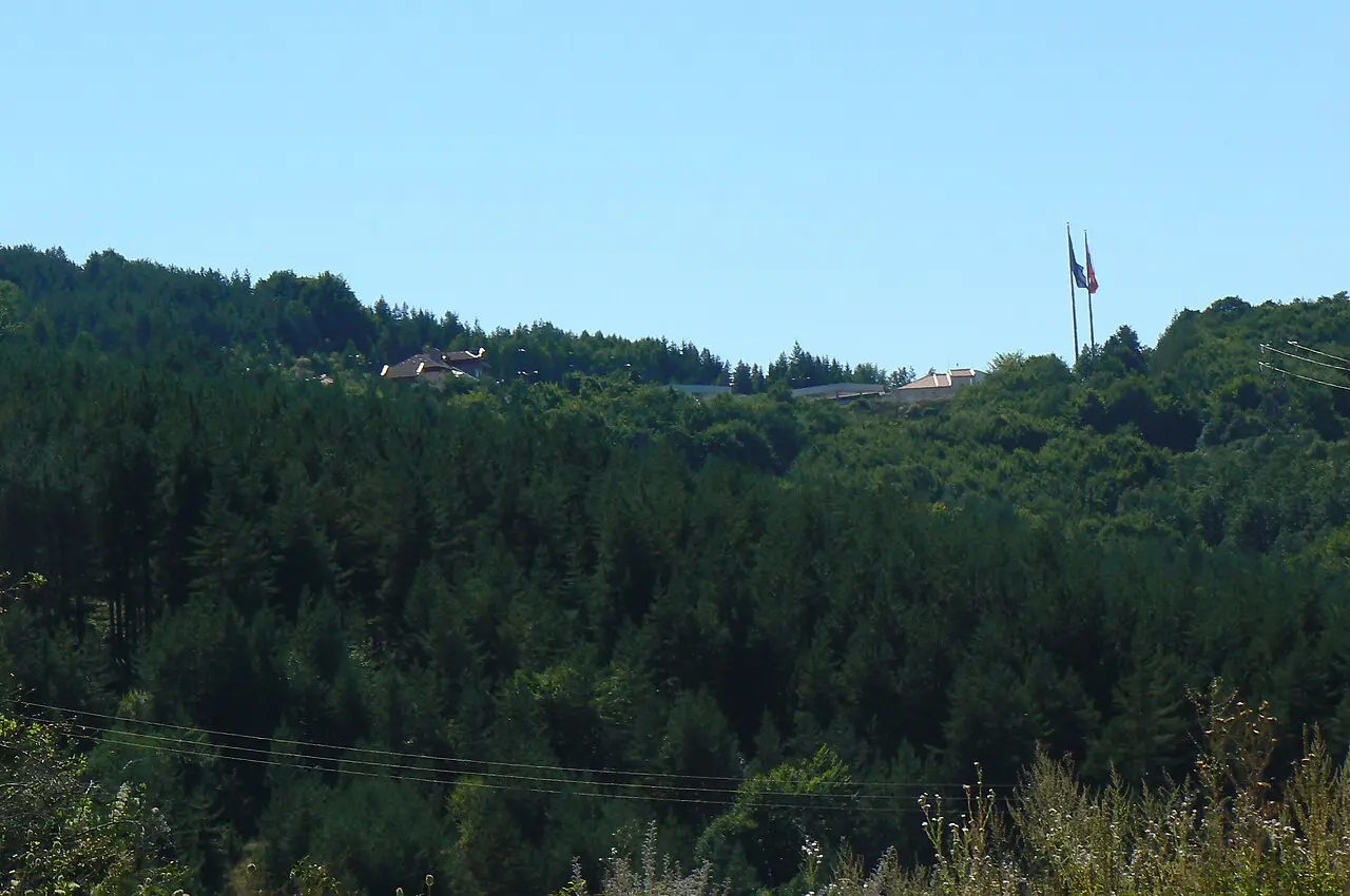 Bulgarian border checkpoint buildings at Gyueshevo with hills behind