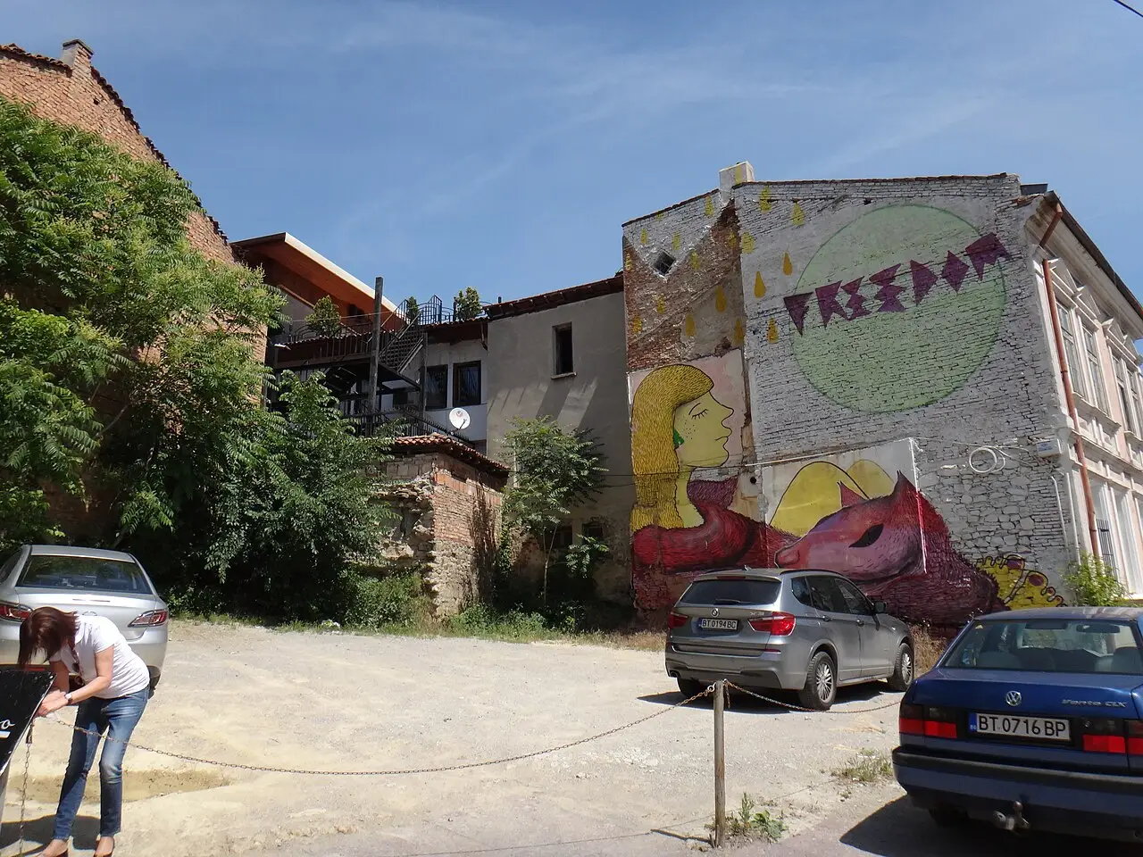Panorama of Veliko Tarnovo with old houses stacked on the steep banks above the Yantra river