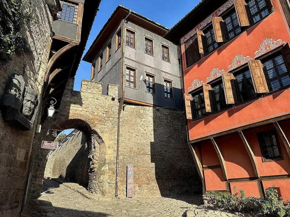 The medieval Hisar Kapia stone gate arching over a cobbled street in the Old Town of Plovdiv