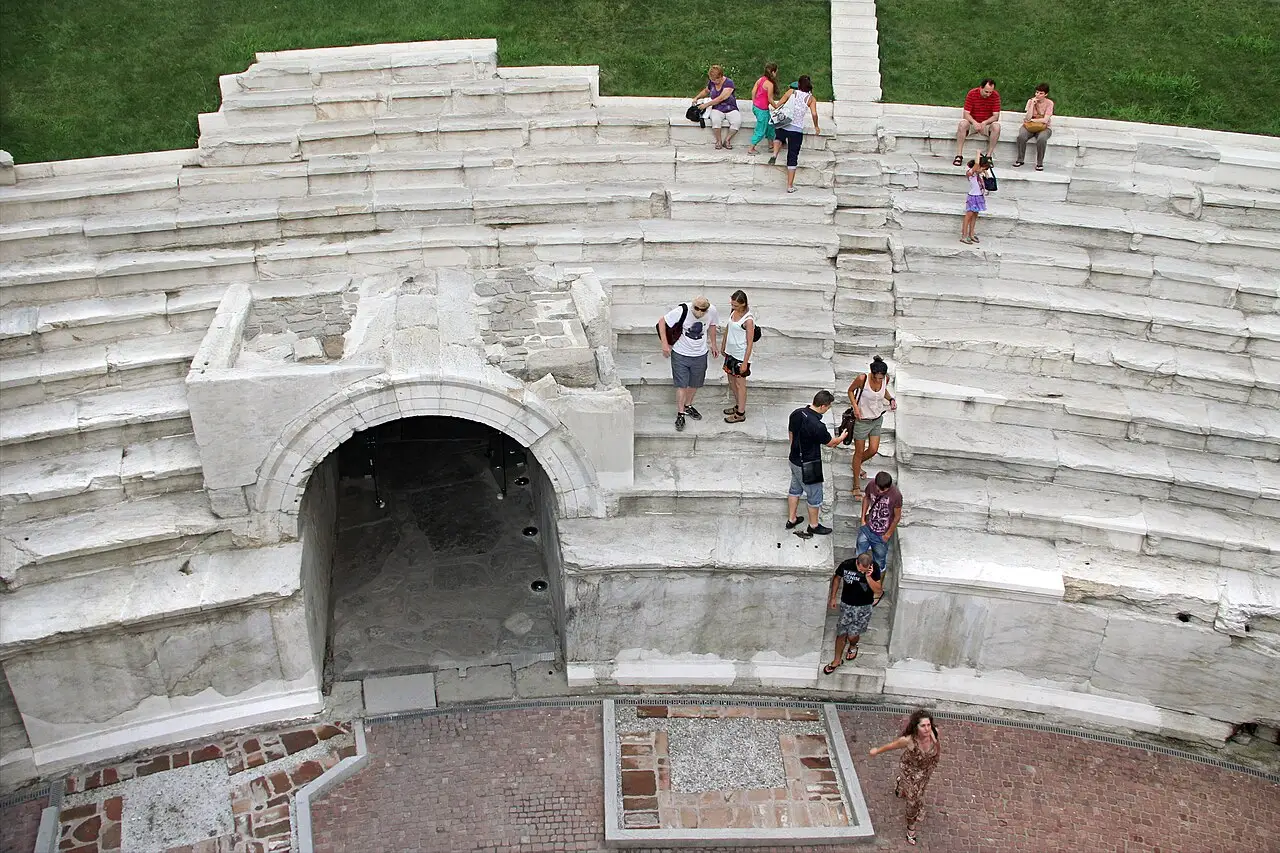 The curved marble seating rows of the Roman Stadium of Philippopolis sunk below Dzhumaya Square in Plovdiv