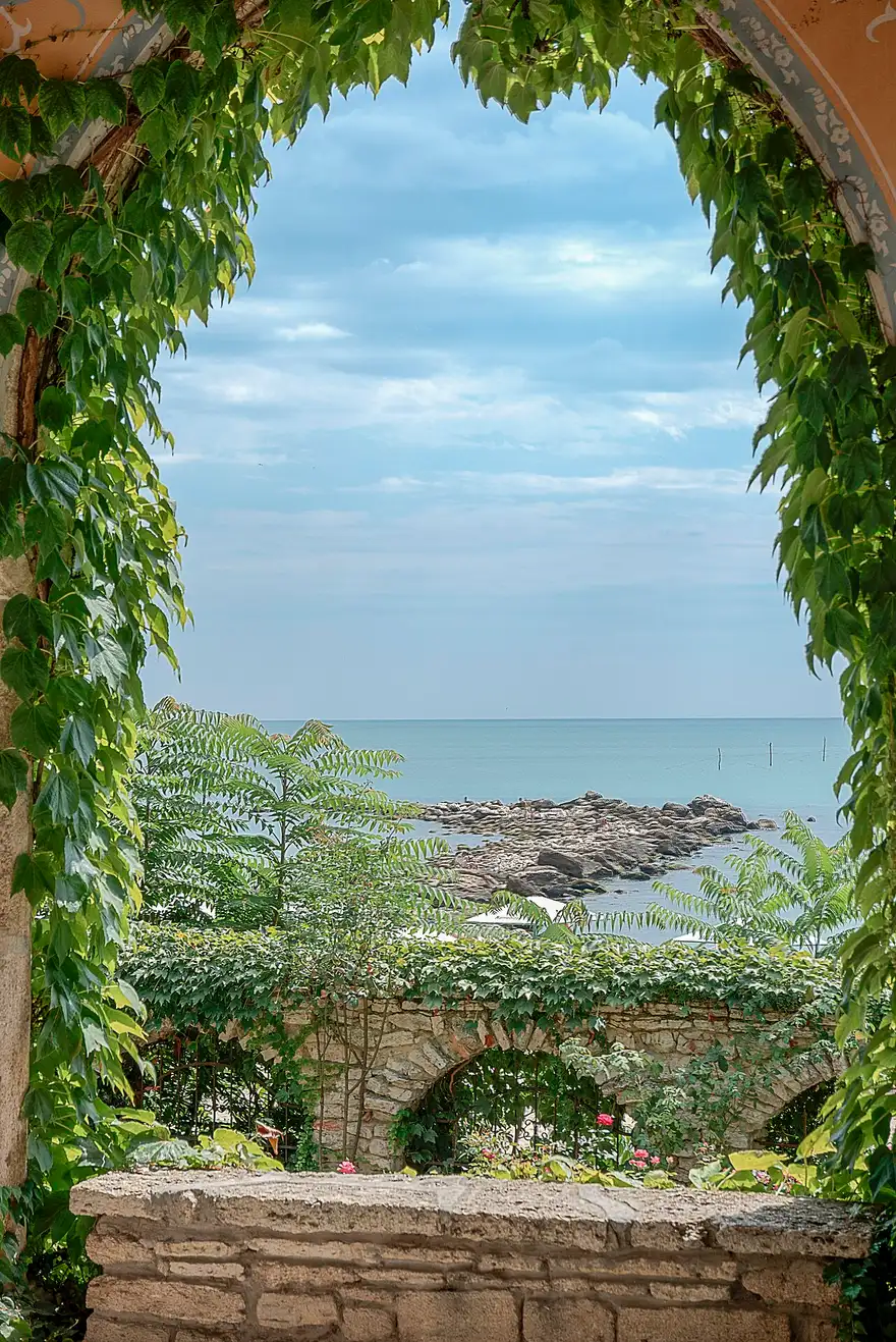 The terraced white palace buildings and green gardens of Balchik above the Black Sea coast