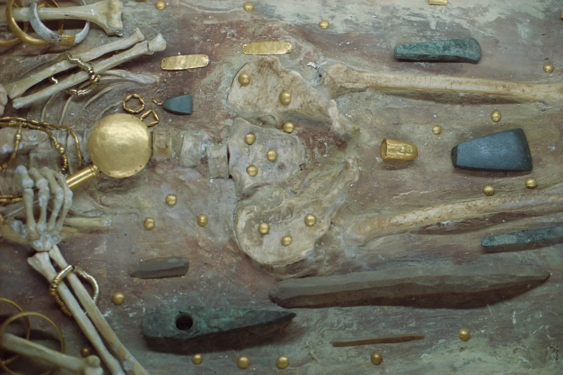 A Chalcolithic grave from the Varna Necropolis laid out with gold plaques, beads and a gold-handled sceptre around the skeleton