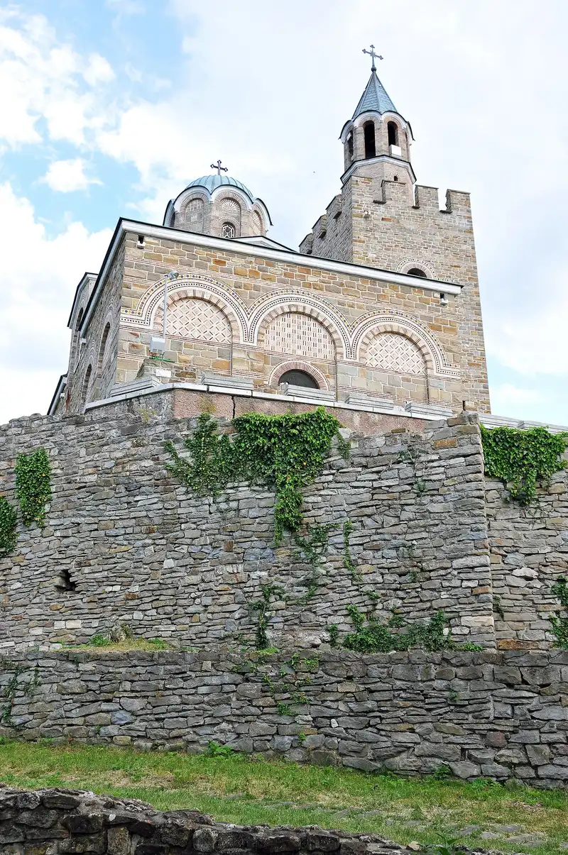 The stone Patriarchal Cathedral of the Holy Ascension crowning the summit of Tsarevets, seen from below the walls