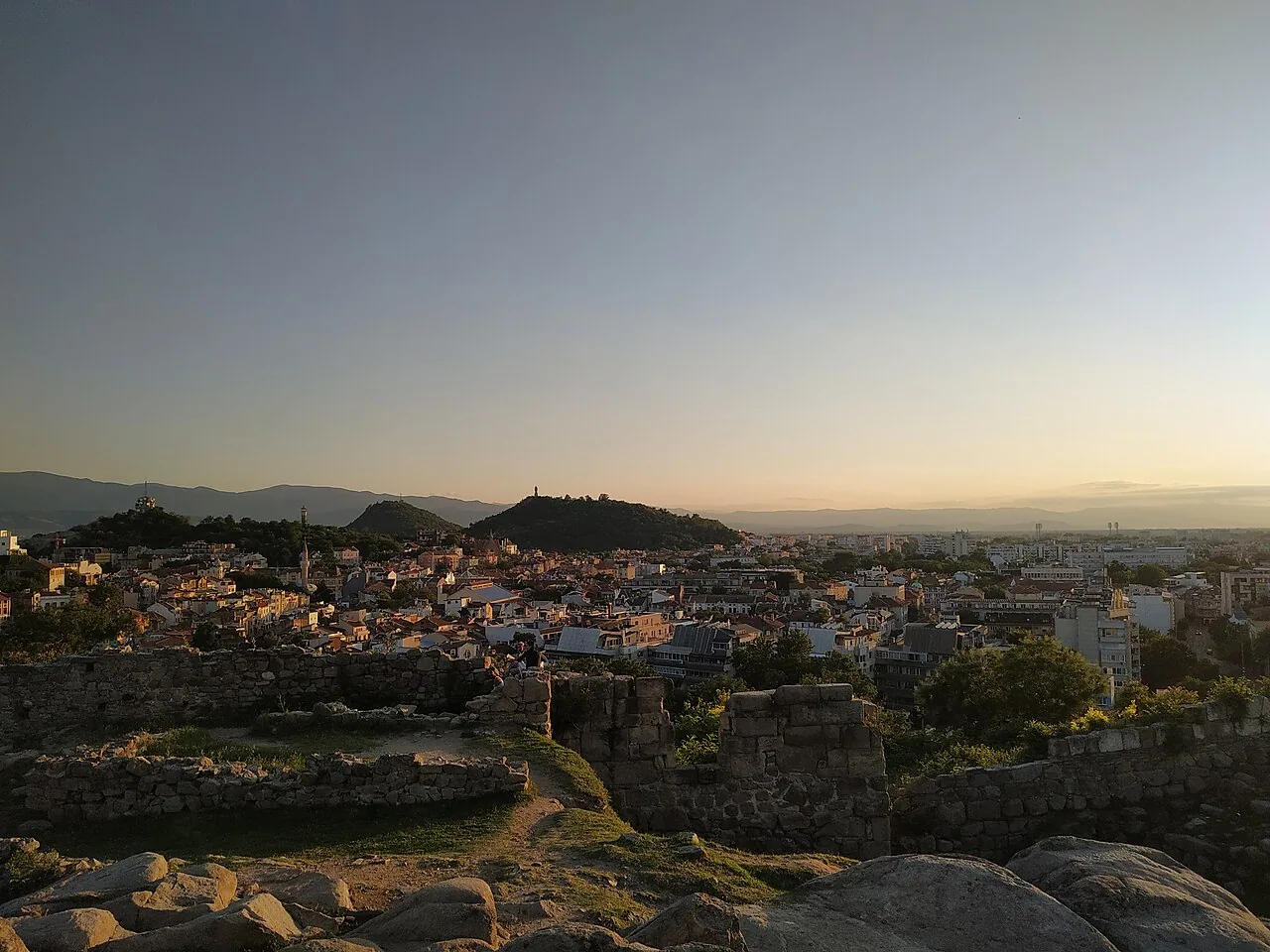 Sunset view over the rooftops of Plovdiv and its hills, seen from the Thracian ramparts of Nebet Tepe in the Old Town