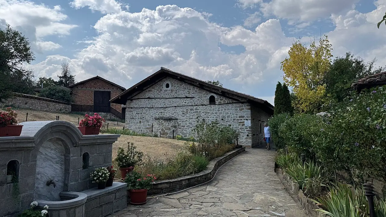 The stone exterior of a historic fortified church in the village of Arbanasi near Veliko Tarnovo