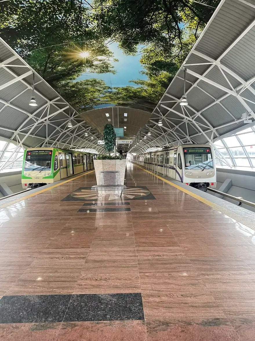 The Sofia Airport metro and rail station building, photographed in January 2026, with signage and a covered walkway