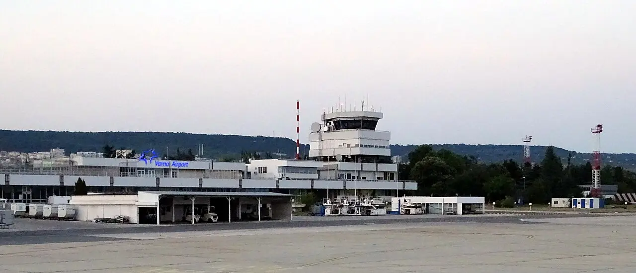 The low terminal building of Varna Airport seen across the apron under a clear sky