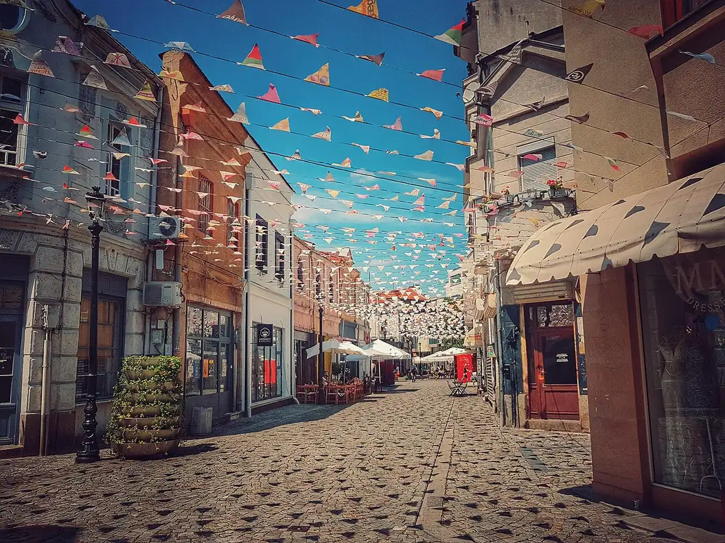 The Kapana quarter in Plovdiv, a cobbled lane hung with colourful bunting above cafe tables